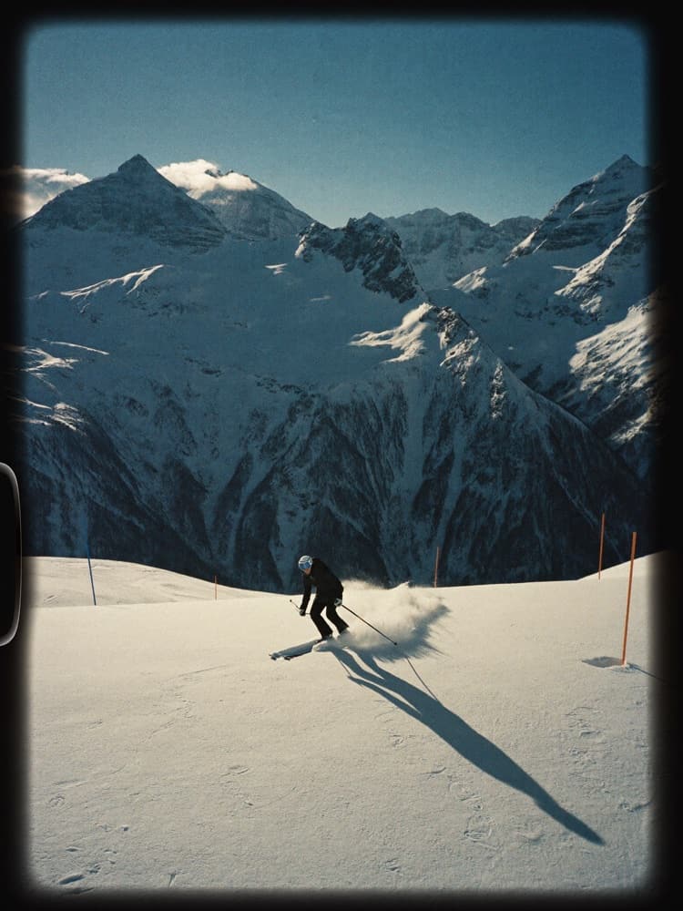 Snowy landscape above Courchevel, ski tracks in untouched powder